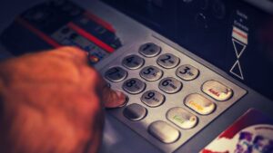 Hand on cash register