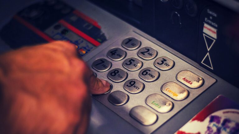 Hand on cash register