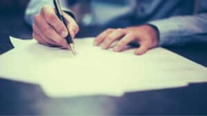 business person writing