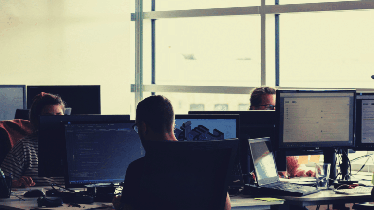people using computers in an office